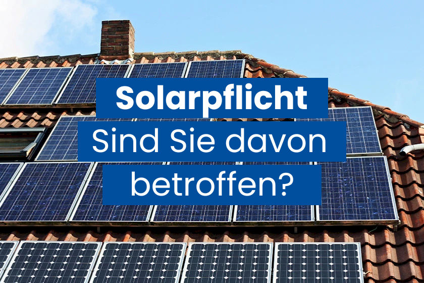 Solarpflicht Überschrift vor Dach mit PV-Anlagen